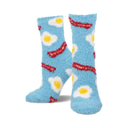 Pair of light blue fuzzy socks with a pattern of fried eggs and bacon. Crew-length, comfy and fun!