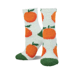 Pair of fuzzy crew socks in white with orange fuzzy oranges and green leaves.  Toes are dark green fuzzy.