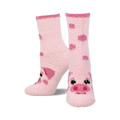 Pair of pink fuzzy crew socks with scattered pig face designs. The socks are light pink with darker pink pig features.