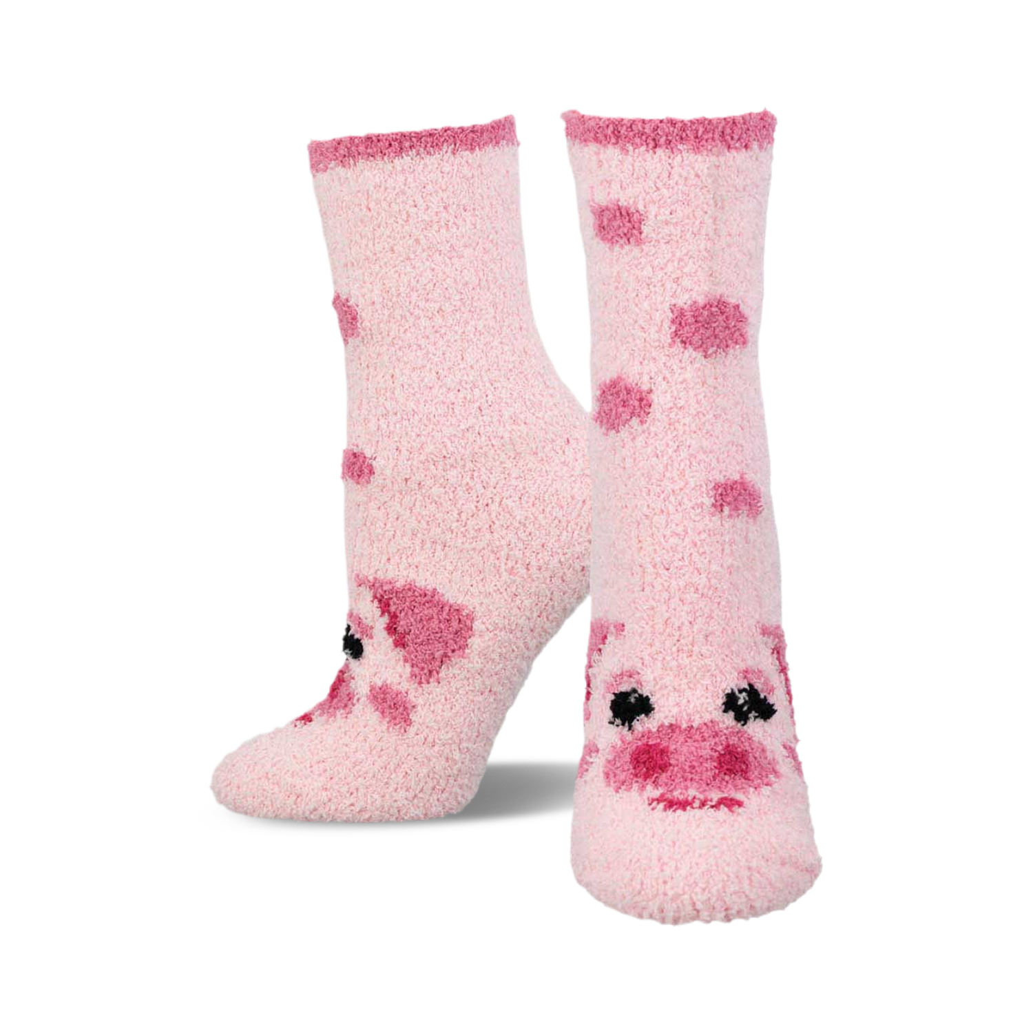 Pair of pink fuzzy crew socks with scattered pig face designs. The socks are light pink with darker pink pig features.