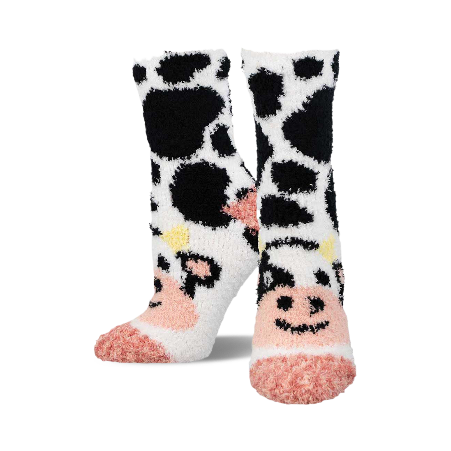 Pair of fuzzy crew socks featuring a black and white cow pattern with pink accents.  The toes are a solid pink.