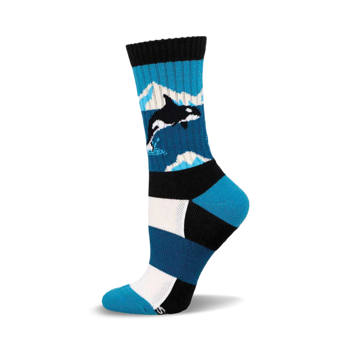 a pair of socks with a blue and white striped pattern and a black orca whale on one of the stripes.  the socks are black at the top and have white stripes near the bottom. }}