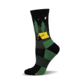 Crew socks in black and green featuring a campsite scene with a bear in a tent, trees, and a crescent moon at night.