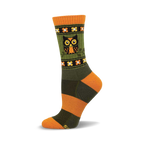 Crew socks in olive green and burnt orange with a repeating floral pattern and a central owl image.