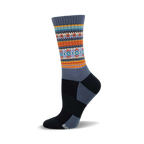 A side view of a crew wool sock in grey, orange, teal, and blue. The sock features a serape-inspired pattern in the mid-calf area.