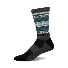 a grey sock with a blue, green, and white geometric pattern on the top of the sock.