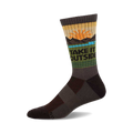 A crew wool sock in dark brown, olive green, and tan, showing a sunset and mountain graphic with the text 'TAKE IT OUTSIDE'.