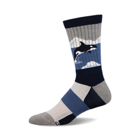 a blue and gray sock with an orca on it.