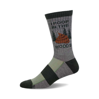 a grey sock with black and green stripes. it has the words "i poop in the woods" and a cartoon image of poop in the woods on it.