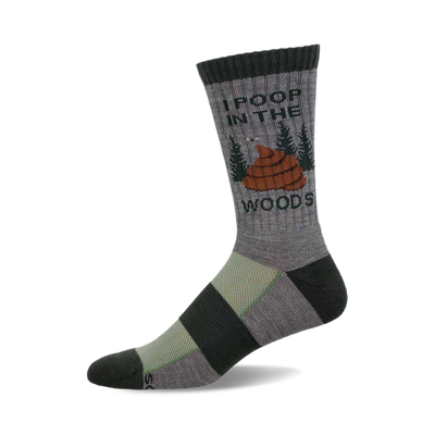 a grey sock with black and green stripes. it has the words "i poop in the woods" and a cartoon image of poop in the woods on it.