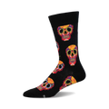 Crew socks in black with a colorful Dia De Los Muertos sugar skull pattern. Red, yellow, and other colors are used for the skull designs.
