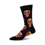 Crew socks in black with a colorful Dia De Los Muertos sugar skull pattern. Red, yellow, and other colors are used for the skull designs.