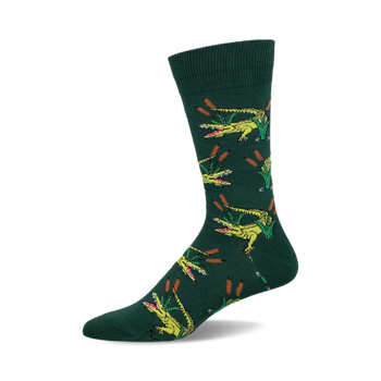 a green sock with a repeating pattern of yellow alligators with open mouths and green reeds.