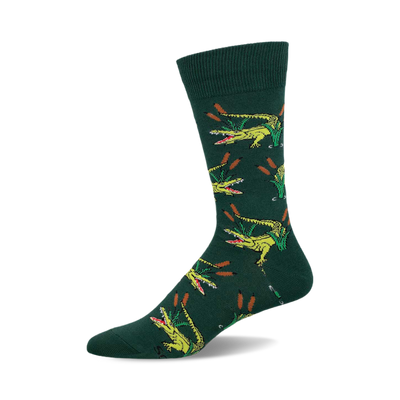 a green sock with a repeating pattern of yellow alligators with open mouths and green reeds.