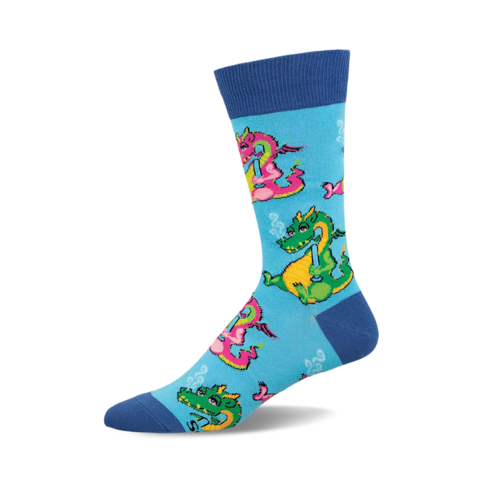 a blue sock with a pattern of green and pink dragons.  the dragons are cartoon-like and have happy expressions. the background of the sock is blue.  the sock is folded in half, so the toe portion is tucked into the heel.  the toe of the sock is blue. }}