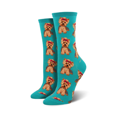 Pair of teal crew socks with repeating pattern of brown and tan Yorkshire Terriers wearing pink bows.