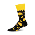 A black crew sock with a yellow cuff and a design of yellow macaroni and cheese pieces.  The sock is shown from the side.