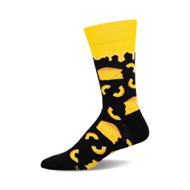 a black sock with a yellow top and a pattern of yellow cheese and macaroni.