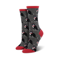 A pair of women's crew socks in gray with a repeating pattern of black tuxedo cats wearing red bow ties. The socks have coral red cuffs.