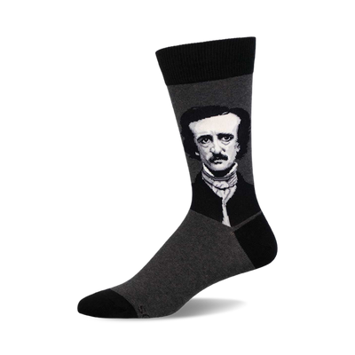 a pair of grey socks with a black and white image of edgar allan poe on the top of one sock.