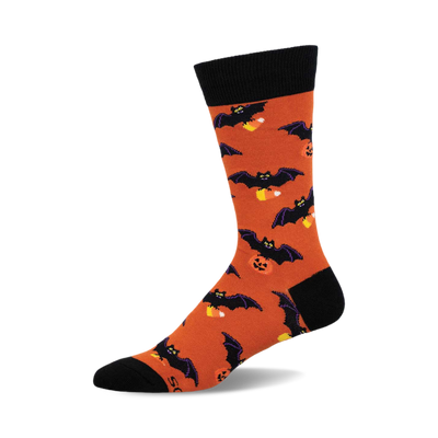 Orange crew socks with black bats and candy corn designs. Black cuff. Fun Halloween socks.