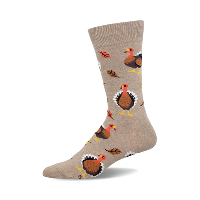 a tan sock with a pattern of brown turkeys and orange leaves.