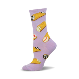 a pair of lavender socks with a pattern of cannoli.  the cannoli are filled with ricotta cheese and topped with chocolate chips.