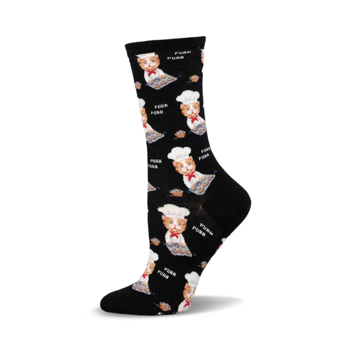 a black sock with a white cat wearing a chef hat and holding a pie.  the sock has a repeated pattern of the cat and 