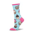 Crew socks in pastel blue with colorful cupcake designs. Pink accents at the top and toe.