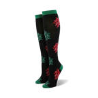 Pair of women's knee-high socks. Black with red and green Christmas bows. Green cuffs.