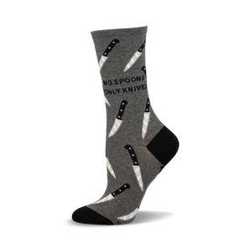 a gray sock with a black and white knife pattern and the words "no spoons only knives" on it.