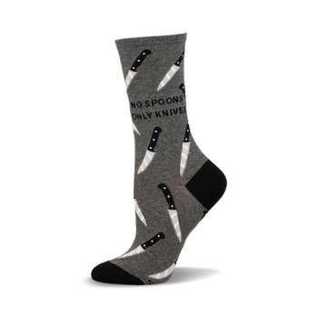 a gray sock with a black and white knife pattern and the words "no spoons only knives" on it.