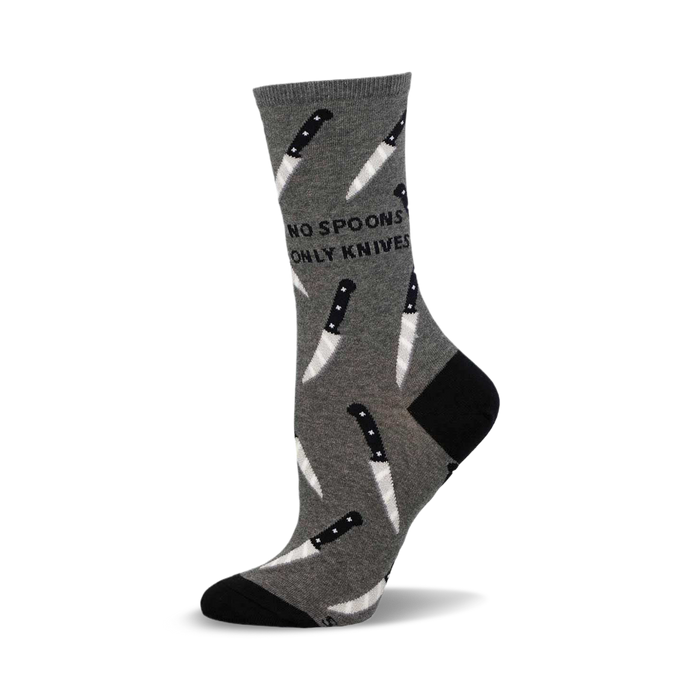 a gray sock with a black and white knife pattern and the words 