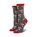 Pair of women's crew socks; gray background with repeating pattern of black cats wearing Santa hats and scarves.