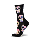Black crew socks with a colorful sugar skull pattern. The skulls feature pink, blue, yellow, and orange floral details.