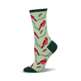 a green sock with red cardinal birds and black branches.