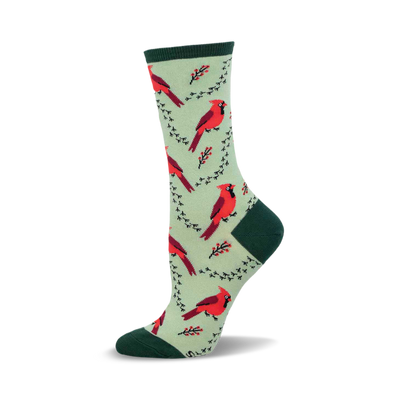 a green sock with red cardinal birds and black branches.