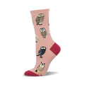 Crew socks in blush pink with illustrated owls in various colors and patterns. Red heel and toe.