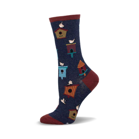 a blue sock with a red cuff. there are multiple small, colorful birdhouses and birds on the sock.