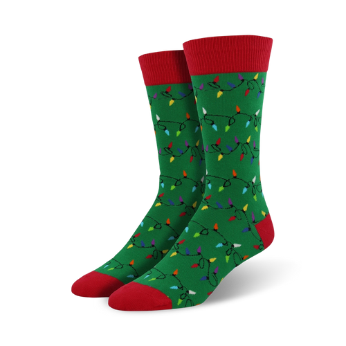 A pair of green crew socks adorned with a whimsical pattern of colorful Christmas lights. Red accents on the cuffs and toes add a festive touch.