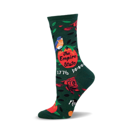 a green sock with a red apple, blue bird, roses, and the text "the empire state est 1776".  the sock is on a white background.