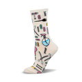 Cream crew socks adorned with a playful pattern of pastel-colored hair styling tools like scissors, combs, hair dryers, and hair clips.