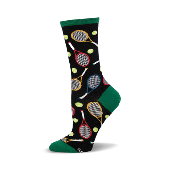 a black sock with a green cuff. the sock has a pattern of tennis rackets and tennis balls.