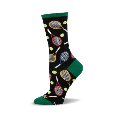 a black sock with a green cuff. the sock has a pattern of tennis rackets and tennis balls.