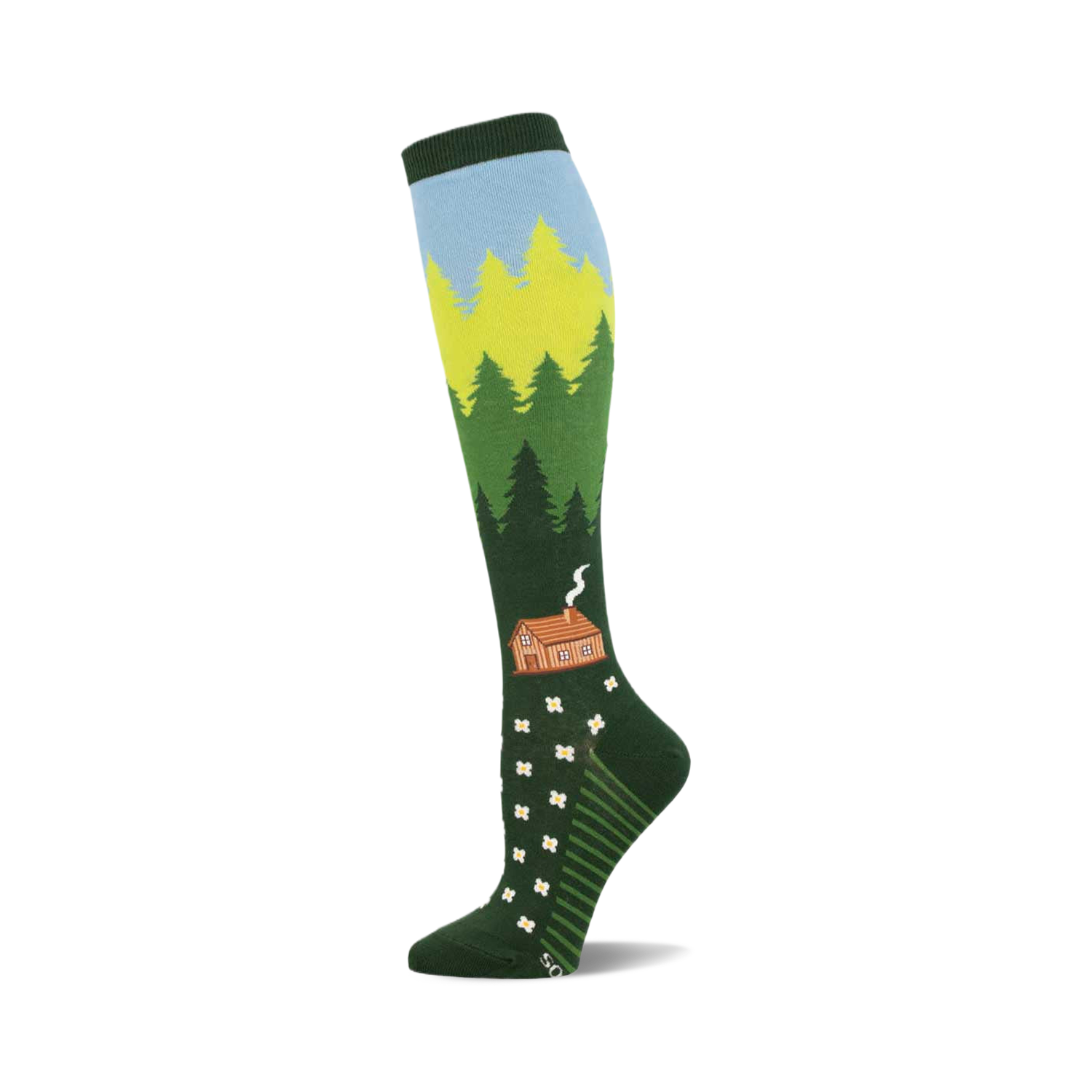 Knee-high socks in green, blue, and yellow depicting a forest scene with a cabin and white flowers. 