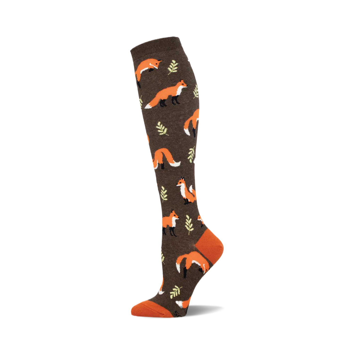 A brown knee-high sock with a repeating pattern of orange foxes and small green leaves. The toe and cuff are a contrasting burnt orange.