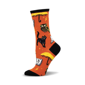 an orange sock with black and yellow designs of owls, cats, umbrellas, and a calendar. the sock is a crew length and has a black toe and heel.