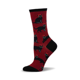 a red sock with a black cat wearing a red hat pattern.