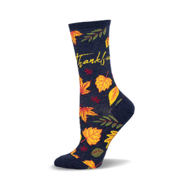 a navy blue sock with the word "thankful" and a pattern of yellow, orange, and red leaves.