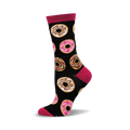 A black crew sock with pink and brown donut designs. The sock has a fuchsia cuff and is made of bamboo.